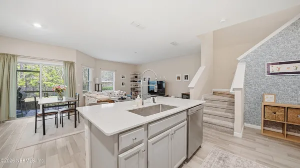 a view of kitchen island a sink and living room