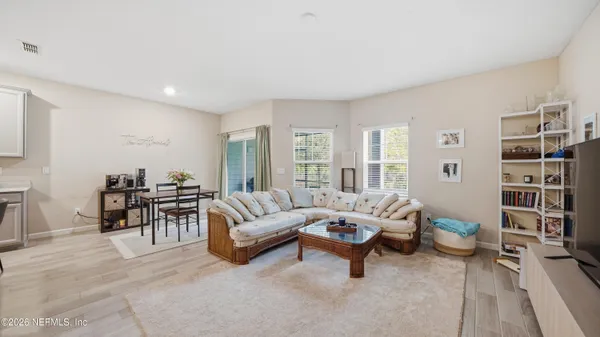 a living room with furniture and a table