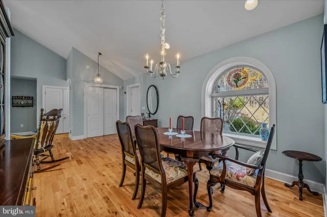 a view of a dining room with furniture and window