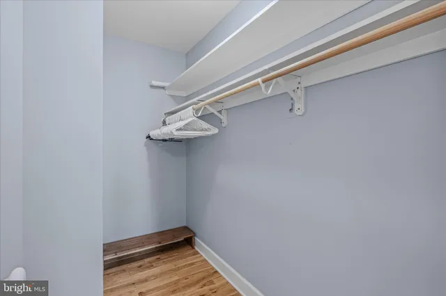 a view of a work space with furniture and wooden floor