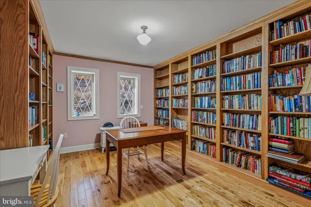 a room with furniture and a book shelf
