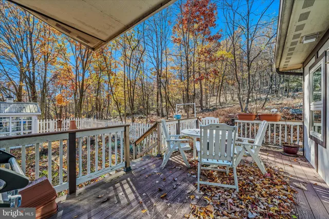 a view of a patio with a table chairs and a table
