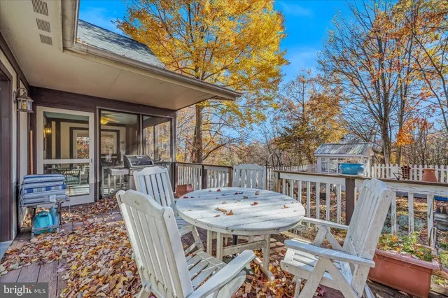 a table and chairs in front of a house