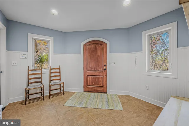 a view of a livingroom with furniture and a chandelier