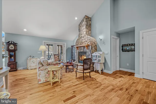 a bedroom with furniture and a fireplace