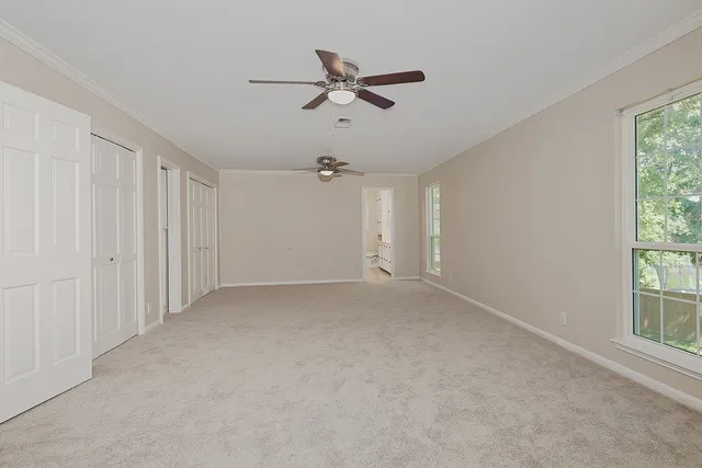 a view of an empty room with a window