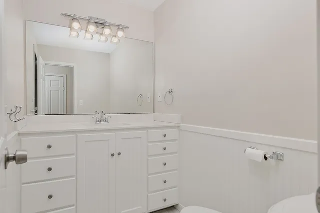 a bathroom with a sink and mirror
