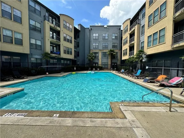a view of a building with a yard