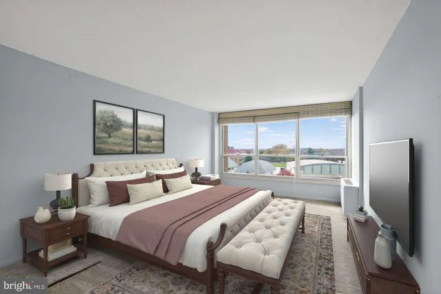 a bedroom with a bed and glass window