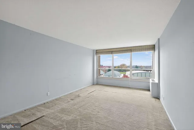 an empty room with a outdoor view