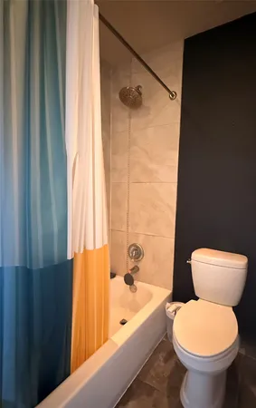 a bathroom with a tub and a sink