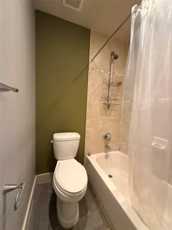 a spacious bathroom with a sink and a mirror