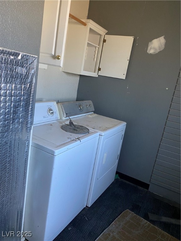 4830 McGraw Road Pahrump, NV 89061 - Photo 11 of 26 Laundry area featuring washing machine and dryer and cabinet space