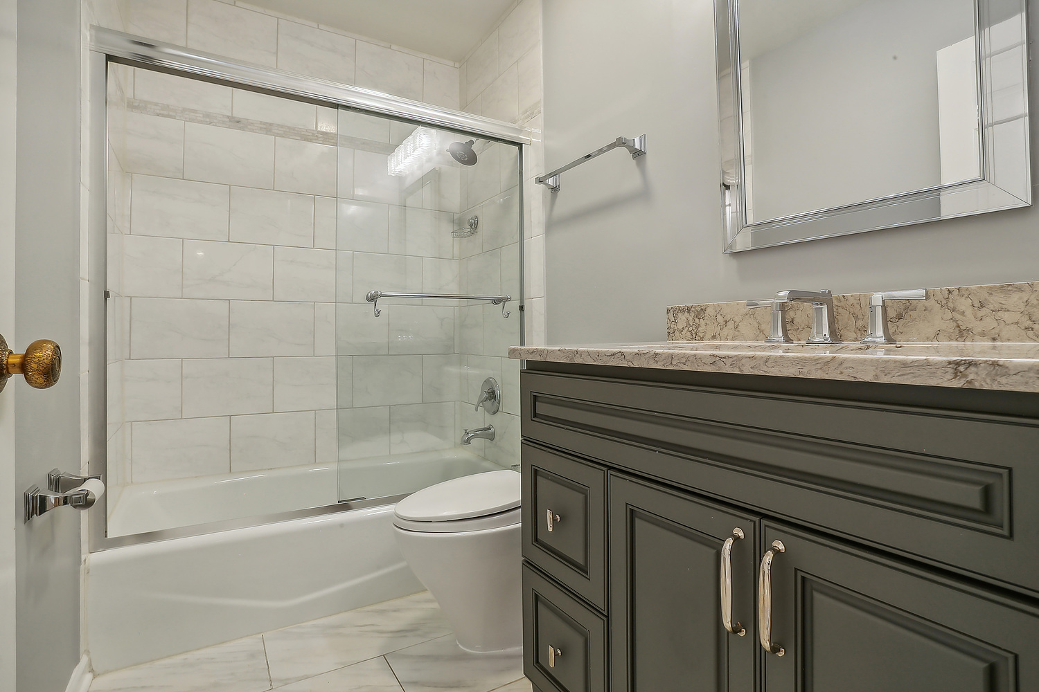 4010 Dundee Road Northbrook, IL 60062 - Photo 11 of 14 a bathroom with a sink a toilet and shower
