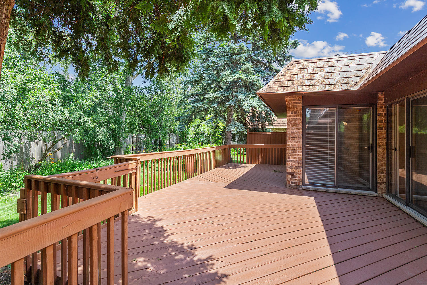 4010 Dundee Road Northbrook, IL 60062 - Photo 14 of 14 a view of balcony with wooden floor and fence next to a yard
