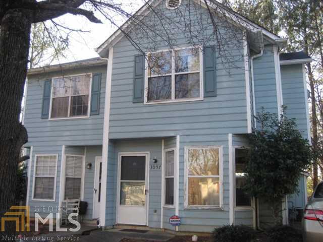 3057 Springside Run Decatur, GA 30034 - Photo 1 of 1 a view of a brick house with large windows