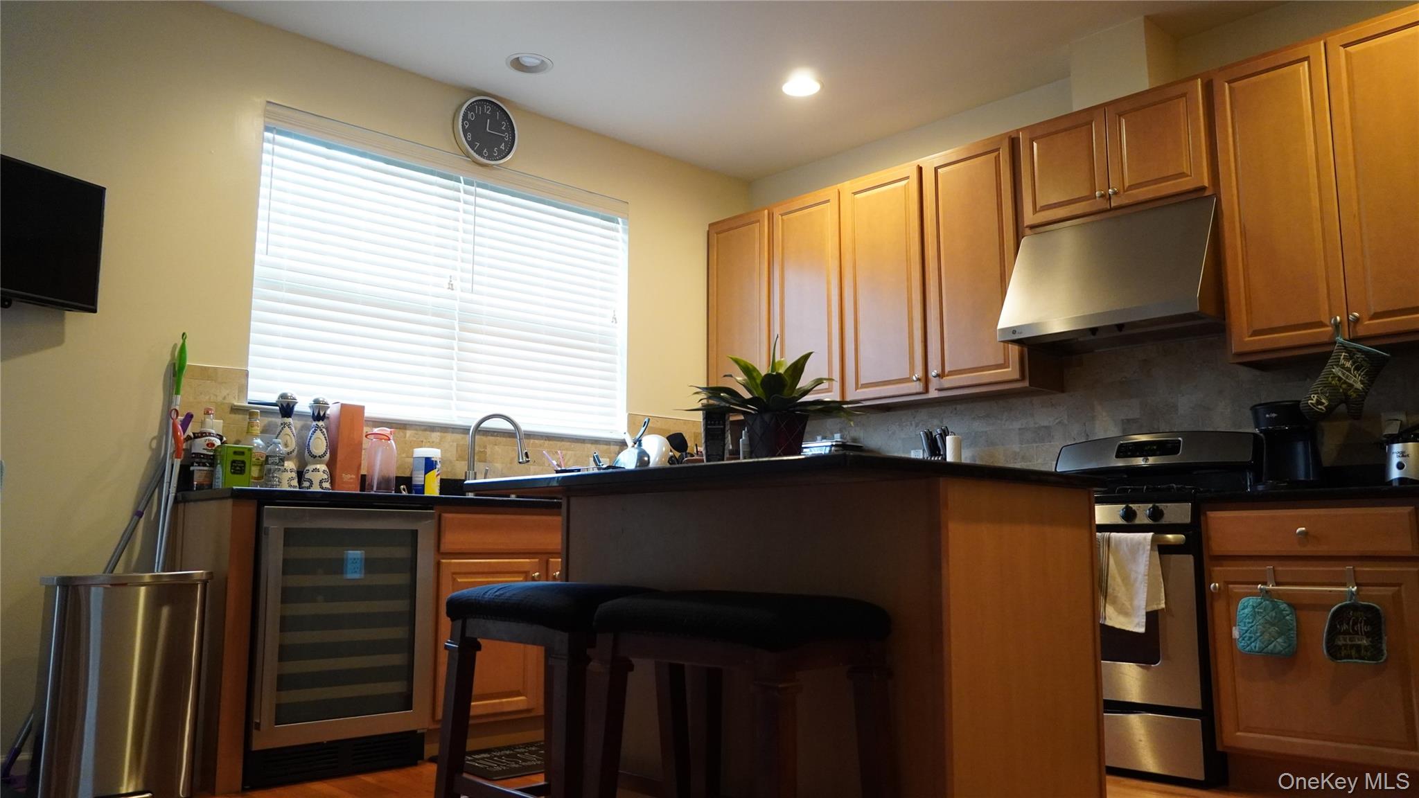 1402 Hawthorn Way New Windsor, NY 12553 - Photo 9 of 25 a kitchen with granite countertop a sink stove and refrigerator