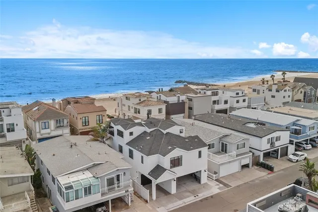 an aerial view of residential houses with an outdoor space