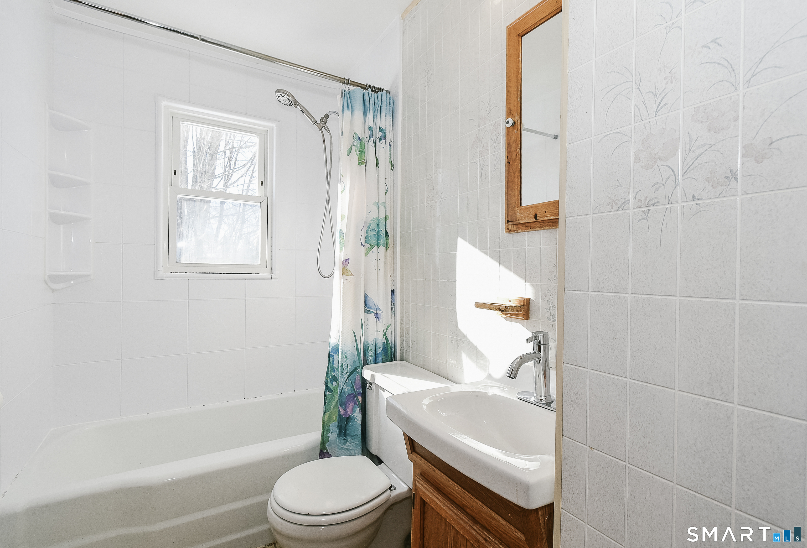 59 Maurice Street Bristol, CT 06010 - Photo 11 of 19 a bathroom with a sink toilet and shower