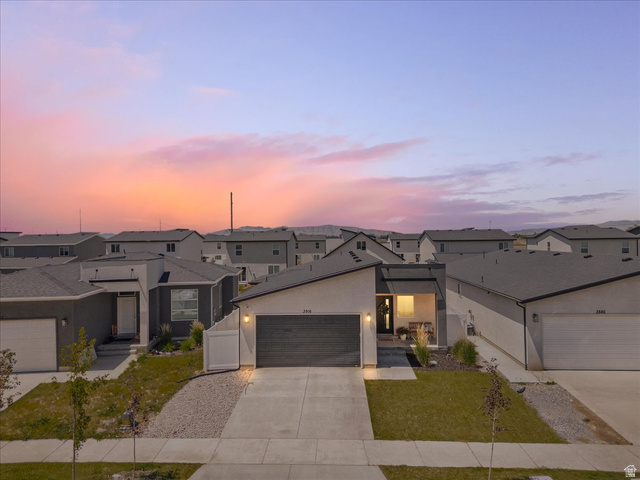 3916 South Sage Wood Avenue Mapleton, UT 84664 - Photo 2 of 33 Contemporary single-story residence featuring a dark gray exterior with white trim