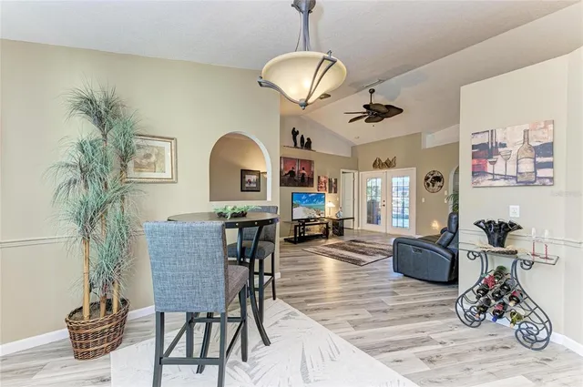 a kitchen with stainless steel appliances kitchen island granite countertop a sink and cabinets