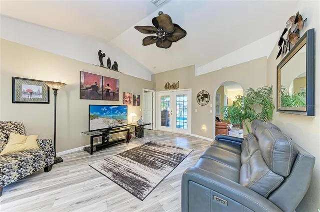 a view of a dining room with furniture wooden floor and chandelier