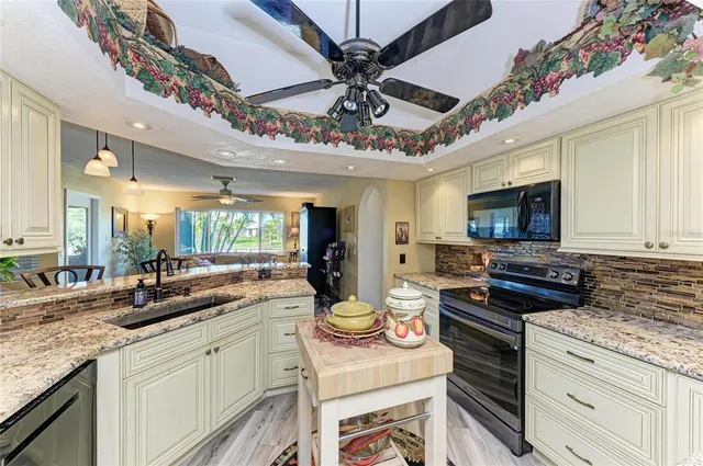 a kitchen with a stove and a sink