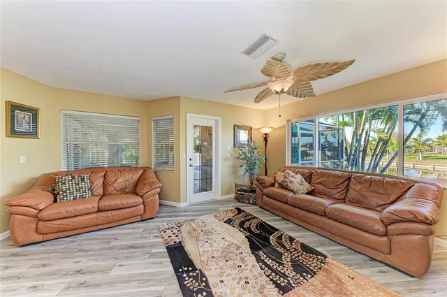 a view of a hallway view with wooden floor and staircase