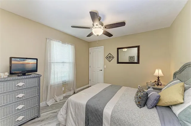 a view of a patio with table and chairs under an umbrella