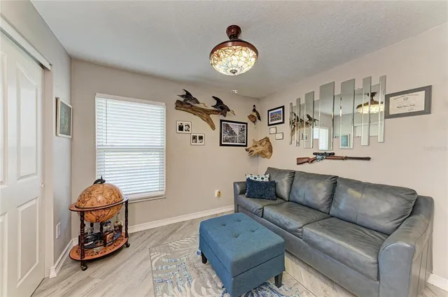 a view of a backyard with sitting area