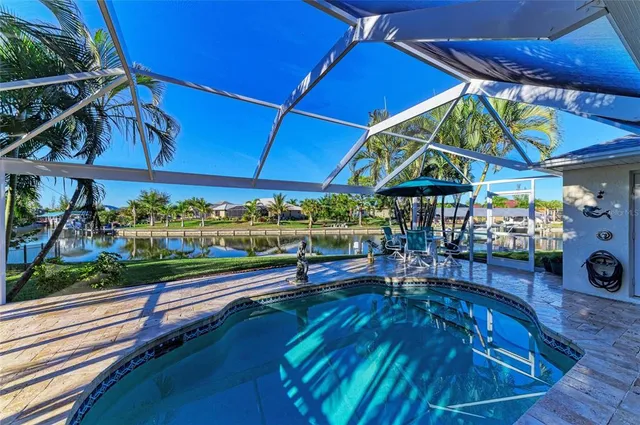 a view of a lake with houses in the back