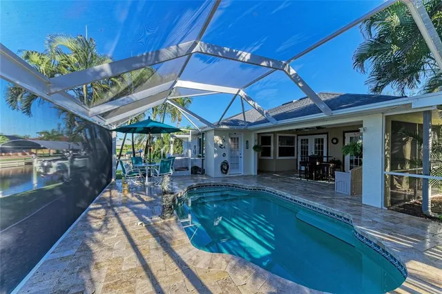 an aerial view of a house with a lake view