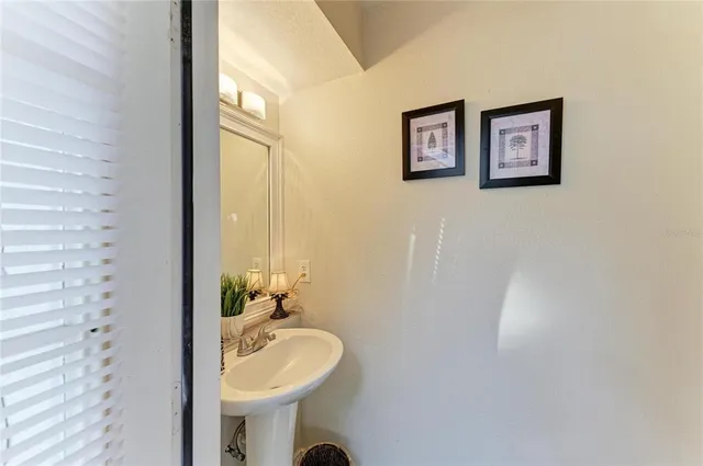 a view of house with swimming pool outdoor seating and yard