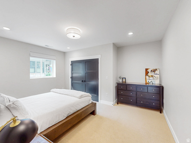 355 East Overlook Loop Hideout, UT 84036 - Photo 34 of 40 Bedroom #4 features bright interior space, a window with white trim, recessed lighting, and a semi-flush mount ceiling fixture