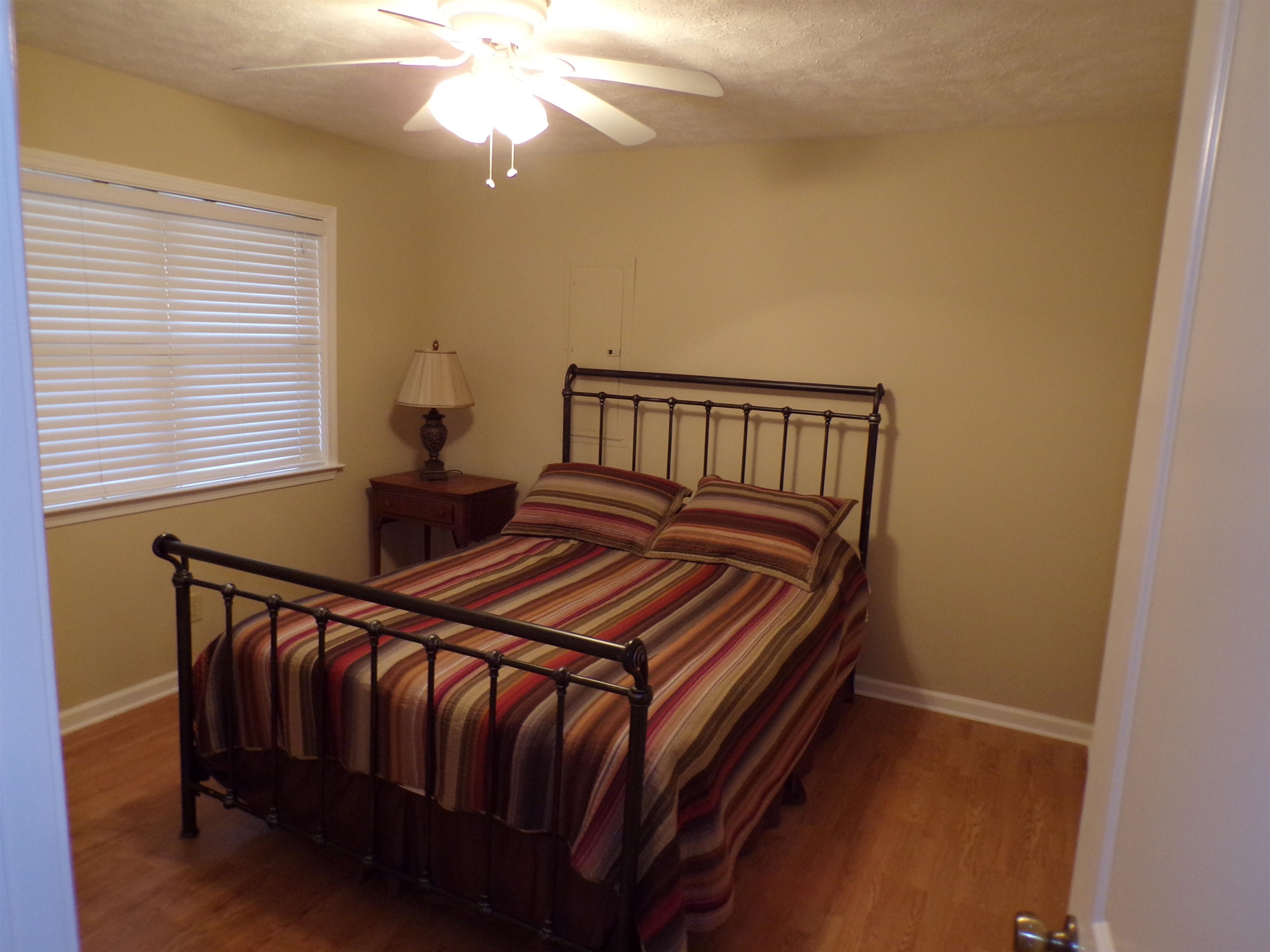 265 Missabbey Lane Counce, TN 38326 - Photo 12 of 21 Bedroom with wood finished floors and ceiling fan