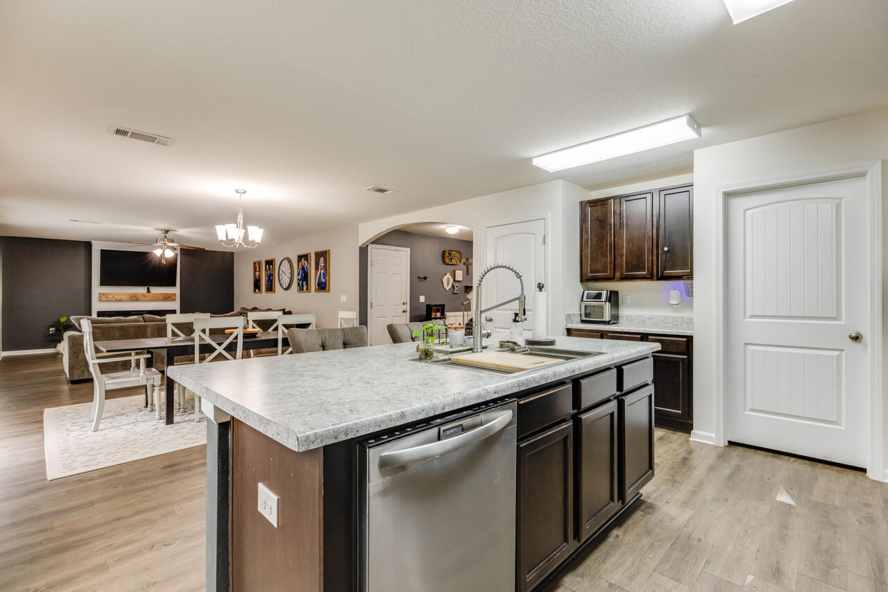 4648 Plover Drive Crestview, FL 32539 - Photo 16 of 71 a kitchen with a stove a counter space and a center island