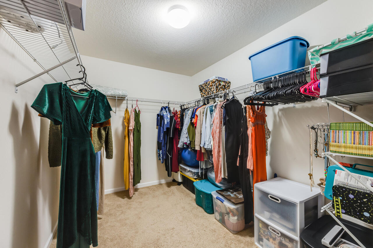 4648 Plover Drive Crestview, FL 32539 - Photo 26 of 71 a view of walk in closet with clothes