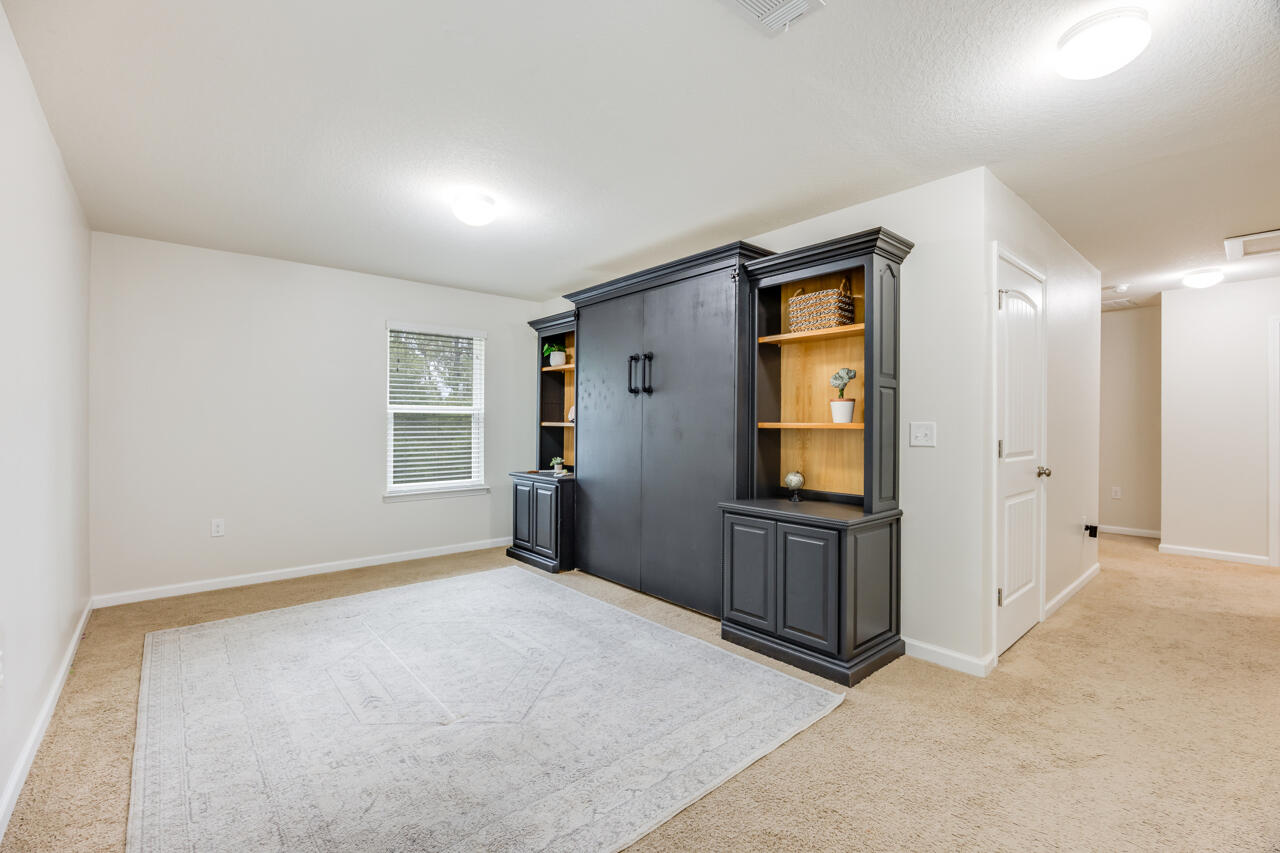 4648 Plover Drive Crestview, FL 32539 - Photo 28 of 71 a view of an empty room with a window and bathroom
