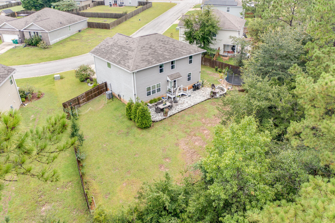 4648 Plover Drive Crestview, FL 32539 - Photo 50 of 71 a aerial view of a house with swimming pool