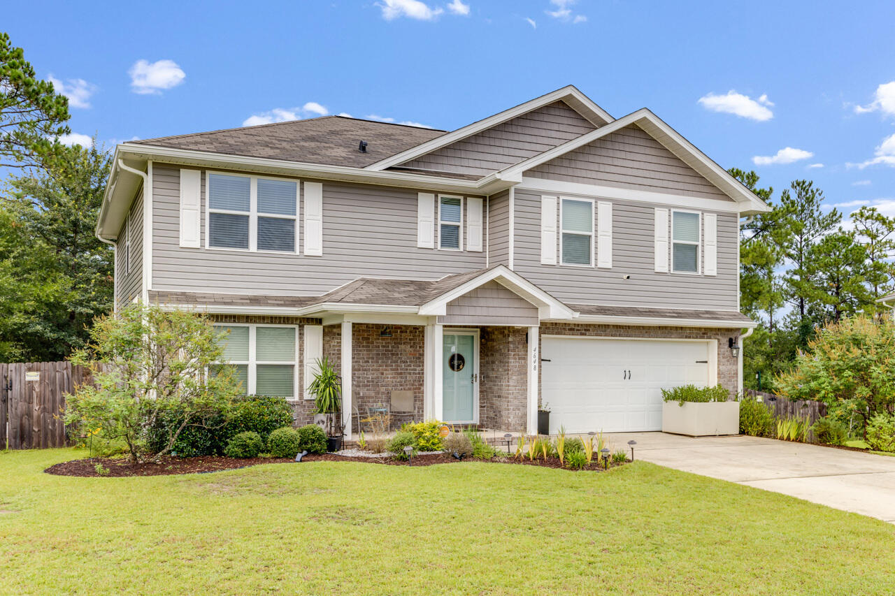4648 Plover Drive Crestview, FL 32539 - Photo 52 of 71 a front view of a house with a yard