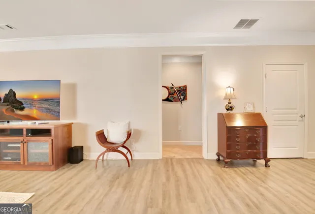 a kitchen with a sink refrigerator and cabinets