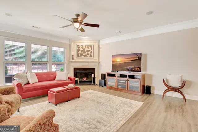 a large kitchen with kitchen island a sink stainless steel appliances and cabinets
