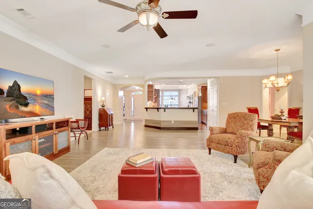 a kitchen with stainless steel appliances granite countertop a refrigerator a microwave and cabinets