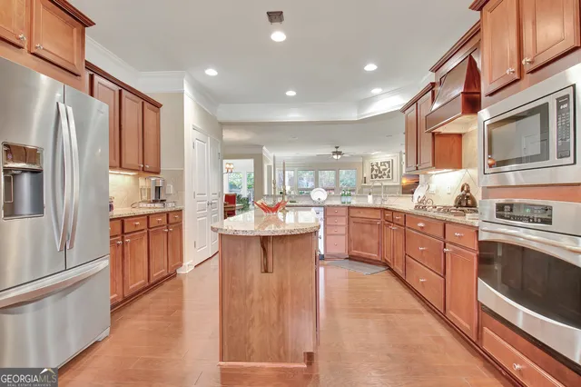a living room with furniture a dining table and chairs in it