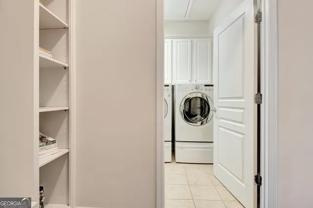 a bathroom with a sink and mirror with bathtub