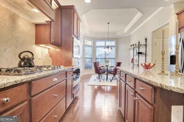 a view of a house with backyard sitting area and garden