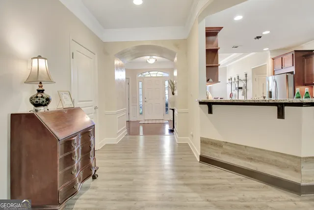 a house view with a sitting space and garden