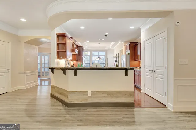 a living room with lots of furniture and a rug
