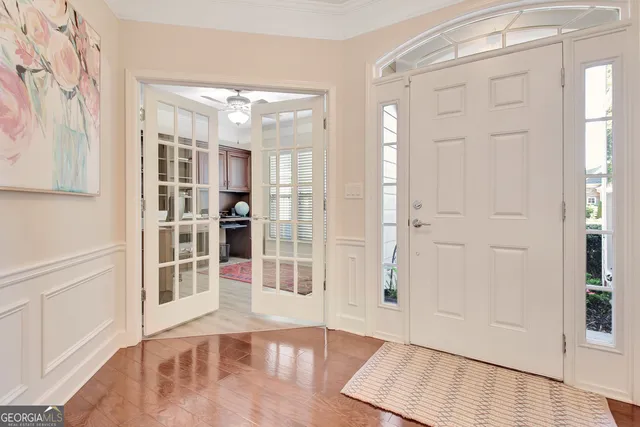 a living room with furniture fireplace and a large window