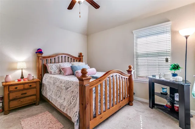 a bedroom with bed and a window